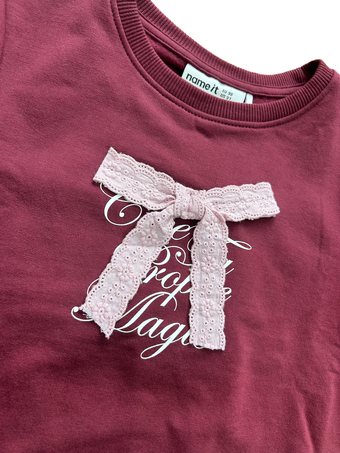 Felpa girocollo bordeaux con fiocco sangallo