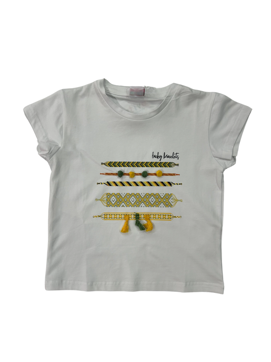 t-shirt bambina bianca a mezza manica con pon pon e nappine